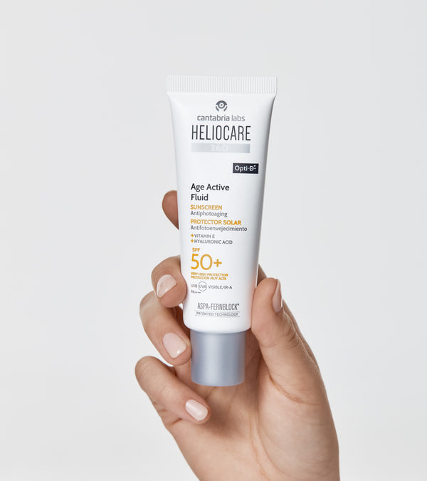 HELIOCARE 360 Age Active Fluid SPF50+ su pakuotės dėžute
