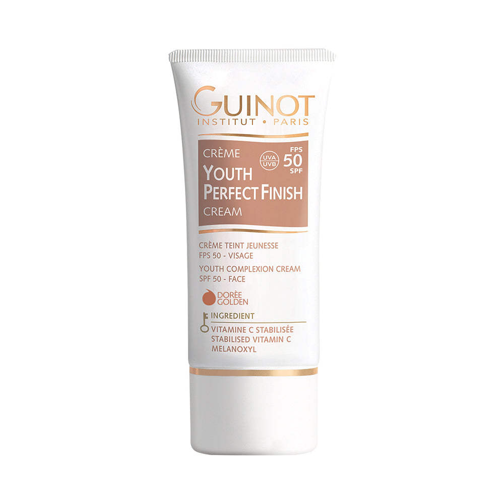 GUINOT Jauninamasis kremas su spalva SPF50, auksinio atspalvio (Youth Perfect Finish Cream, Dorée) 30 ml tūbelė baltame fone